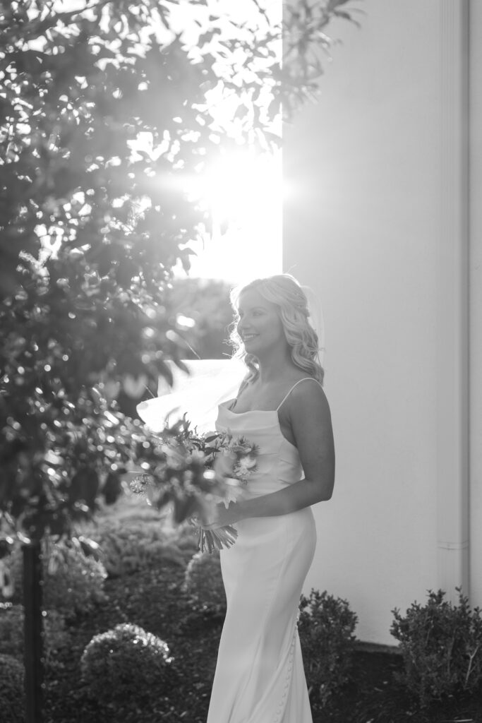 Bride with sunburst at the Arlo Austin Wedding Venue by Lois M Photography