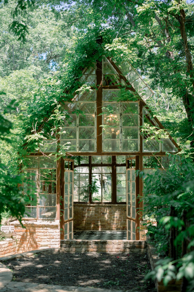 Exterior of Sekrit Theater, a beautiful glass greenhouse in Austin.