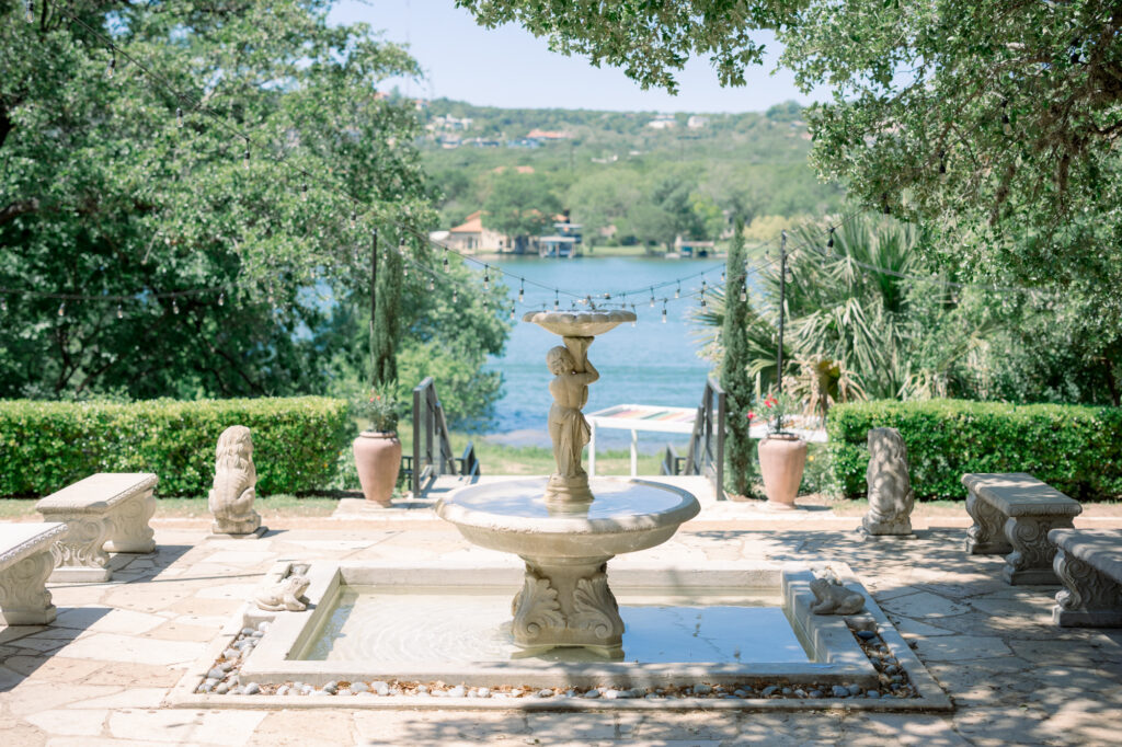 Beautiful fountain outside of Laguna Gloria with views of Lake Austin by Lois M Photography. 