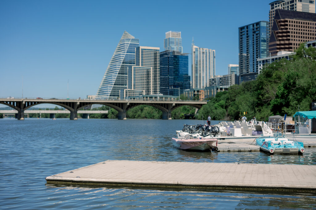 The Retro Boats dock is one of the best places to propose in Austin with cityscape views from Lady Bird Lake.