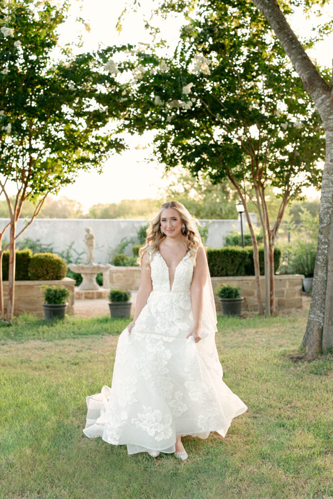 Bride in the gardens at Thistlewood Manor by Lois M Photography