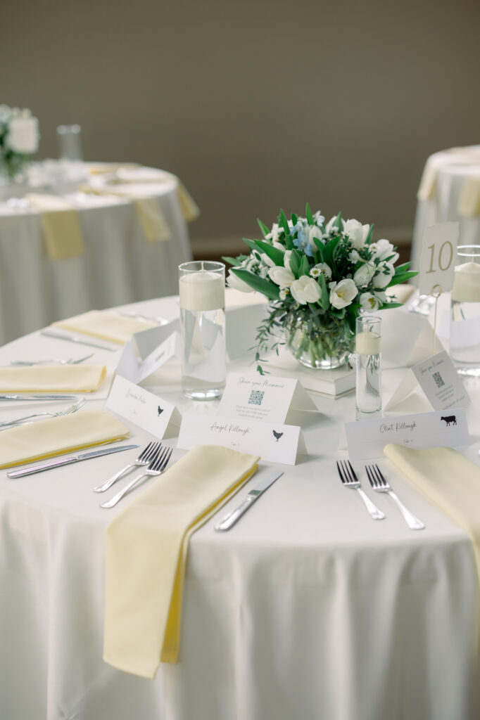 Table scape with pale yellow napkins in the reception hall at the Veranda in San Antonio 