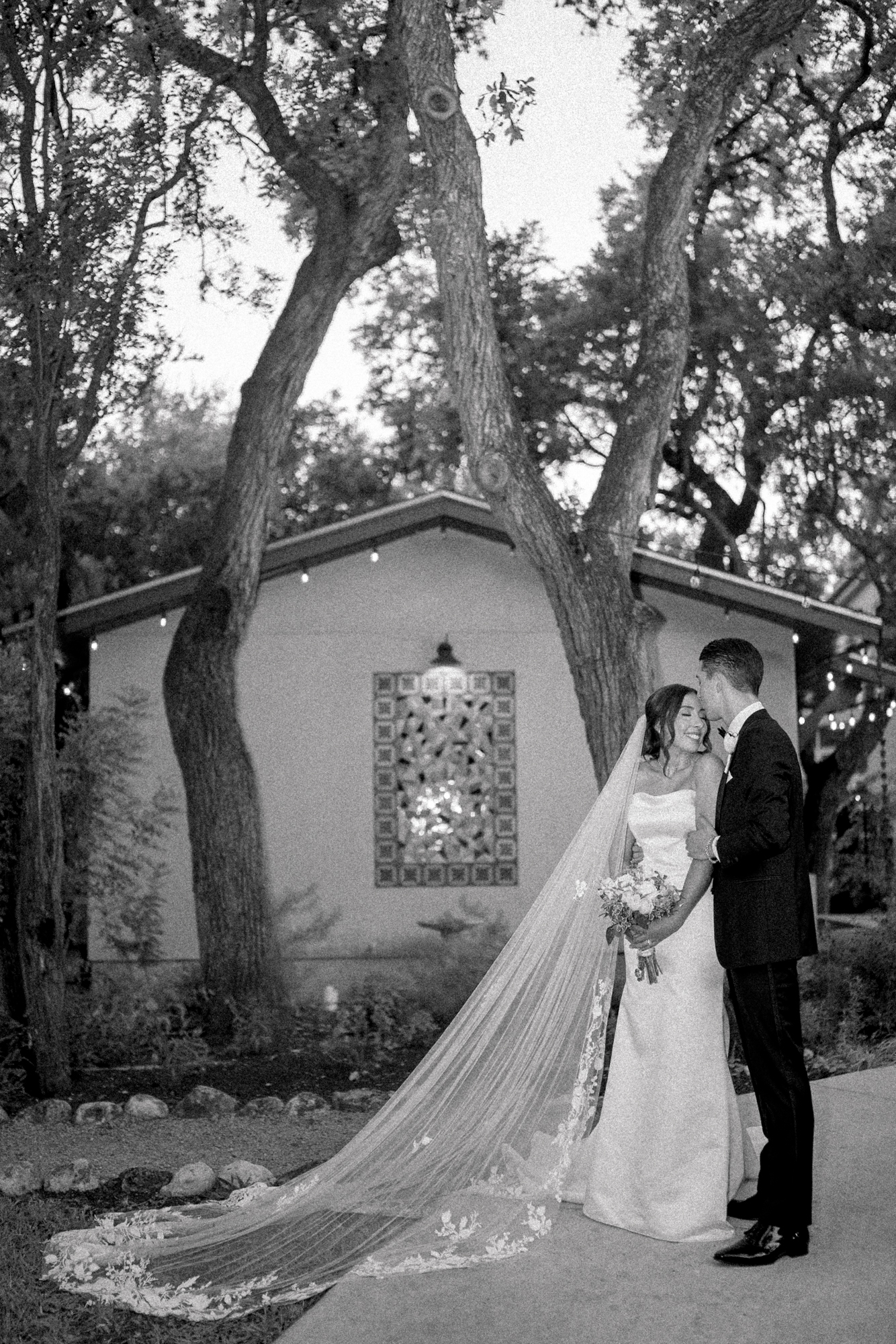 Bride and groom in the evening taking newly wed photos by Lois M Photography in San Antonio at the Veranda 