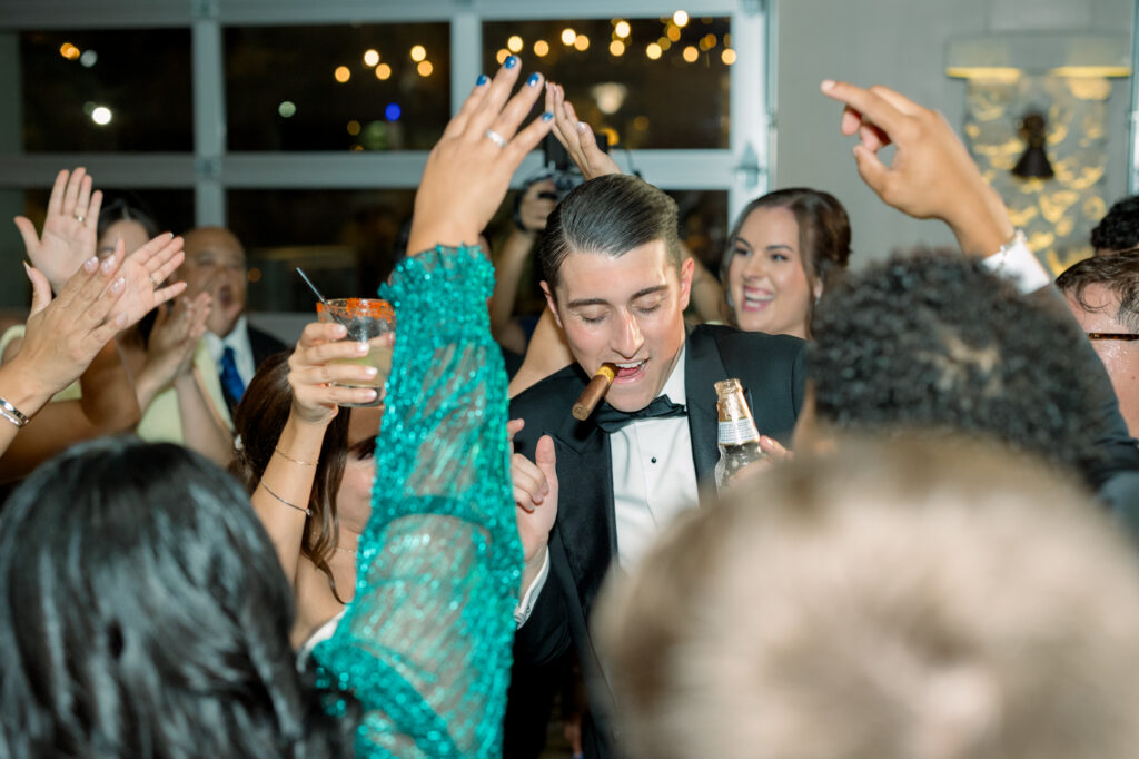 Bride and groom dancing and celebrating in the reception hall at the Veranda in San Antonio, Texas