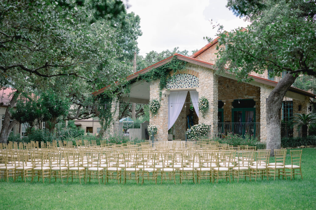 Ceremony site with beautiful florals at the covered Pavilion site at The Veranda San Antonio