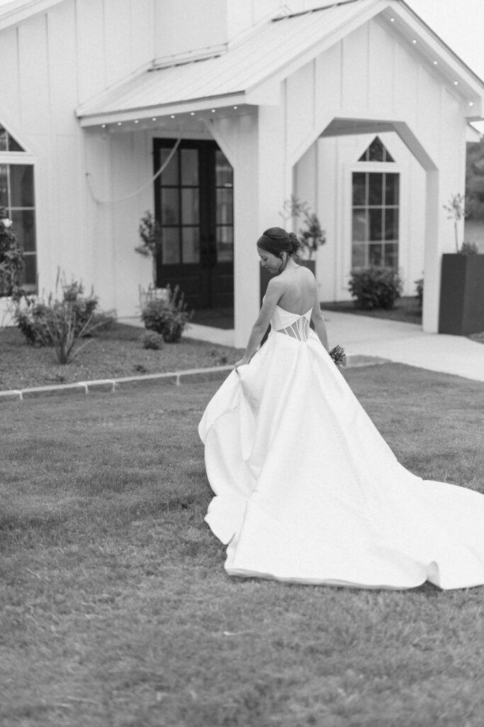 Bride posing in front of Posey Meadows chapel