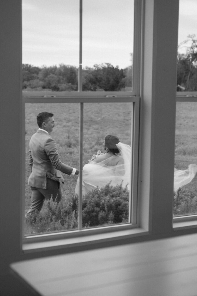 Bride and groom walking in Posey Meadows