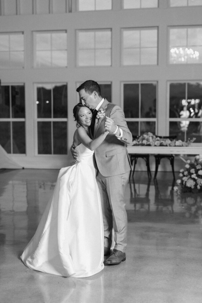 Bride and groom slow dancing at Posey Meadows