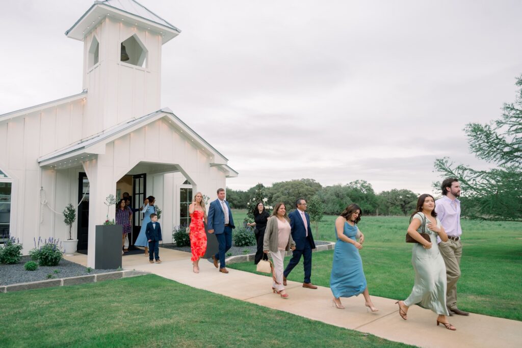 Guests walking out of the chapel at Posey Meadows