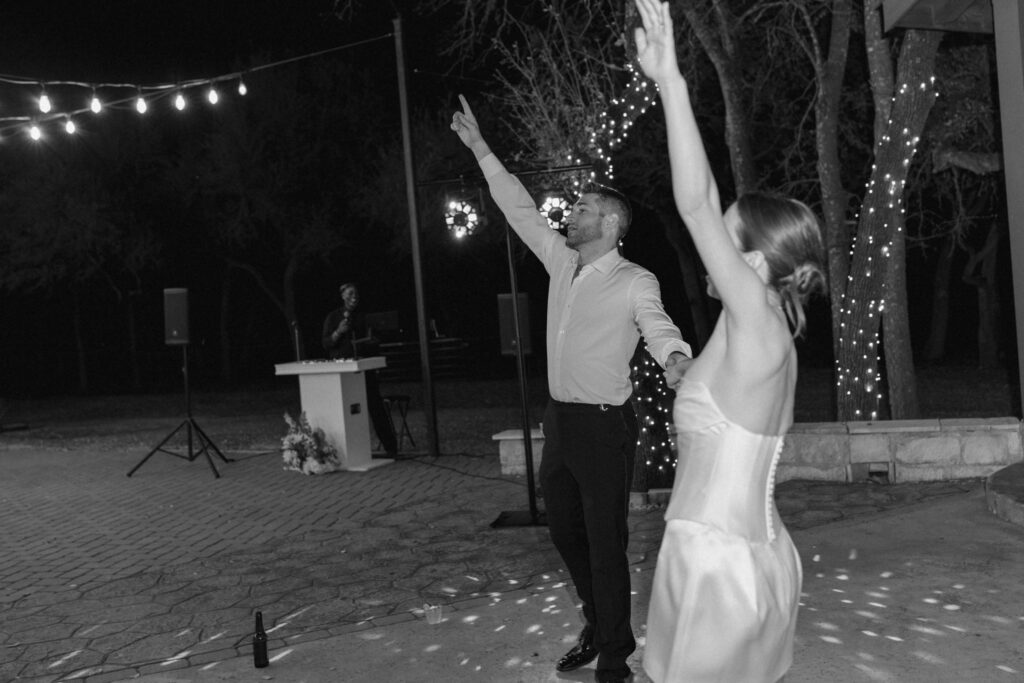 Bride and groom dancing on outdoor patio at Ranch Austin