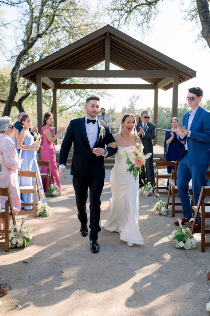 Bride and groom walking back down the aisle at Ranch Austin 