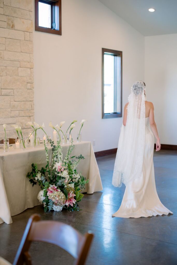 Bride walking into reception space at Ranch Austin