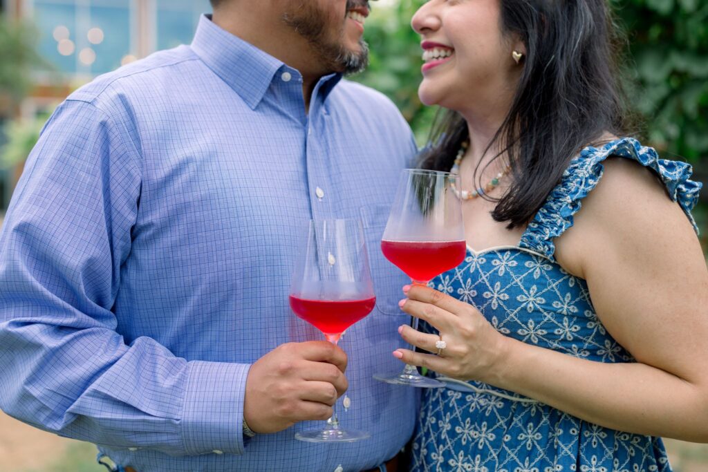 A couple drinking wine outside William Chris Vineyards after getting engaged