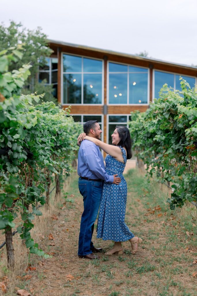 A man and woman embracing at William Chris Vineyards in Texas